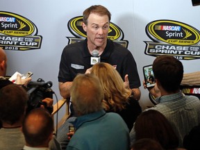 Driver Kevin Harvick answers a question during the NASCAR Sprint Cup series auto racing Eliminator Media Day in Charlotte, N.C., Tuesday, Oct. 27, 2015. The Panthers won 27-16. (AP Photo/Chuck Burton)