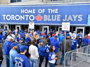 Fans line up to get inside the Rogers Centre during the Blue Jays 2015 post-season run. (THE CANADIAN PRESS/Nathan Denette)