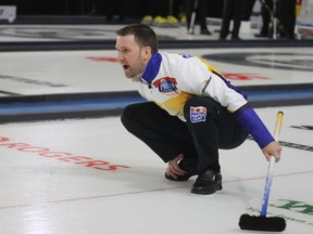 Skip Brad Gushue hollers out instructions to his sweepers during the fifth draw of the Syncrude Elite 10 Grand Slam of Curling event in Fort McMurray Alta. on Friday March 20, 2015. Robert Murray/Postmedia Network files