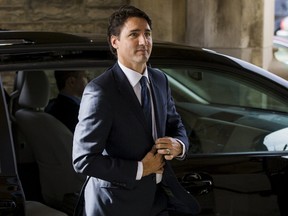 Canada's Prime Minister designate Justin Trudeau arrives at a funeral for Former Canadian ambassador Ken Taylor, in Toronto, October 27, 2015. Former Canadian ambassador Ken Taylor, whose role in rescuing U.S. diplomats in a covert operation in 1979 during the Iran hostage crisis was featured in the movie "Argo", died on Thursday, his son told CBC television. He was 81. REUTERS/Mark Blinch