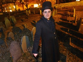 In this Dec. 22, 2003 file photo, Christian Day poses in the Old Burying Ground in Salem, Mass. A judge heard a suit on Wednesday in Salem District Court brought by Lori Sforza, who calls herself a witch priestess, accusing Day, a self-proclaimed warlock, of harassing her online and over the phone for three years. (AP Photo/Lisa Poole, File)