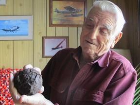 Lloyd Shales shows off a cannon ball from the Spanish galleon El Infante, which went down in 1733 in the Florida Keys. Shales recovered the artifact during a 1960 dive. (Patrick Kennedy/The Whig-Standard)