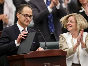 Finance Minister Joe Ceci (left) concludes his Budget 2015 speech next to Premier Rachel Notley (right) on the floor of the Alberta Legislature in Edmonton, Alta., on Tuesday October 27, 2015. Ian Kucerak/Edmonton Sun/