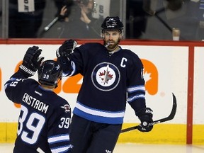 Andrew Ladd suited up in his 700th NHL game on Tuesday night.