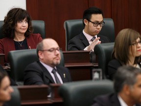 Government MLAs, including Marie Renaud (top left) and Thomas Dang (top right) applaud Finance Minister Joe Ceci as he gives the Budget 2015 speech on the floor of the Alberta Legislature in Edmonton, Alta., on Tuesday October 27, 2015. Ian Kucerak/Edmonton Sun/Postmedia Network