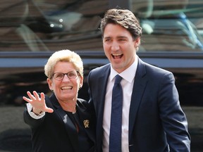 Prime minister-designate Justin Trudeau is greeted at Queen's Park by Ontario Premier Kathleen Wynne on Tuesday, October 27, 2015. (Michael Peake/Toronto Sun)