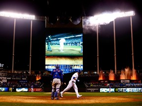 Alex Gordon of the Kansas City Royals scores after hitting a solo home run in the ninth inning against the New York Mets during Game 1 of the World Series at Kauffman Stadium in Kansas City on Oct. 27, 2015. (Jamie Squire/Getty Images/AFP)