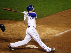 Kansas City Royals' Eric Hosmer hits the game-winning sacrifice fly during the 14th inning of Game 1 of the Major League Baseball World Series against the New York Mets Wednesday, Oct. 28, 2015, in Kansas City, Mo. The Royals won 5-4 to take a 1-0 lead in the series. (AP Photo/David Goldman)