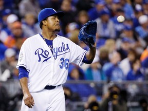Kansas City Royals pitcher Edinson Volquez walks back to the mound after giving up a single to New York Mets' Lucas Duda during the sixth inning of Game 1 of the World Series in Kansas City, Mo., on Oct. 27, 2015. (AP Photo/David J. Phillip)