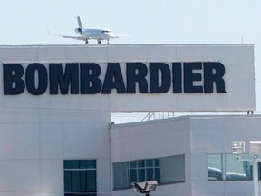 A plane comes in for a landing at a Bombardier plant in Montreal, Thursday, May 14, 2015. (THE CANADIAN PRESS/Ryan Remiorz)