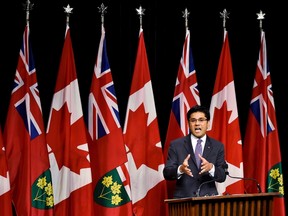 Yasir Naqvi, Ontario Minister of Community Safety and Correctional Services, explains a draft regulation for public input that would prohibit the random and arbitrary collection of identifying information by police, referred to as carding or street checks at Queen's Park in Toronto on Wednesday, October 28, 2015. THE CANADIAN PRESS/Nathan Denette