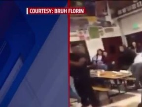 A screen capture from a video posted to YouTube allegedly showing a student at Florin High School in Sacramento tackling the school principal to the ground. (YouTube/Screengrab)