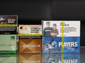 Cigarettes packs are viewed on March 12, 2012 in St. Thomas, Ontario.  AFP PHOTO/Geoff Robins