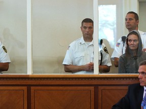 Michael Patrick McCarthy, left, is arraigned in the death of Bella Neveah Amoroso Bond, the girl dubbed Baby Doe, in Dorchester District Court, on Monday, Sept. 21, 2015, in Boston. Rachelle Dee Bond, right, is arraigned for acting after the fact in helping to dispose of the body of her daughter. (Pat Greenhouse/The Boston Globe via AP, Pool)