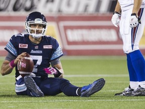 Toronto Argonauts quarterback Trevor Harris sits on the ground after being sacked by the Montreal Alouettes in Hamilton October 23, 2015. (REUTERS/Mark Blinch)