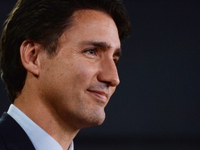 Prime minister-designate Justin Trudeau speaks at the National Press Theatre to during a press conference in Ottawa on Tuesday, October 20, 2015. surprise appearance by Trudeau at a reception of university presidents sends a powerful signal about a fresh tone from Ottawa, says the new head of Universities Canada. THE CANADIAN PRESS/Sean Kilpatrick