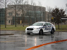 Police investigating a bomb threat and suspicious package at Cegep Heritage College in Hull Wednesday afternoon. The Cegep was one of four to have reported a bomb threat that afternoon.  (Dani-elle Dube/Ottawa Sun)