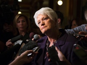 Ontario Education Minister Liz Sandals scrums with reporters at the Ontario legislature in Toronto on Tuesday, October 27, 2015. (THE CANADIAN PRESS/Chris Young)