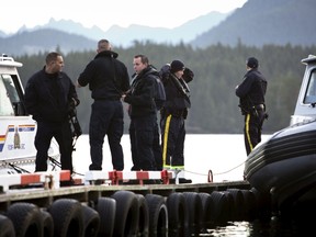 RCMP officers prepare to leave the government dock in search of the last remaining body following the capsize of the Leviathan II whale-watching boat in Tofino, British Columbia, October 27, 2015. Canadian authorities were still searching on Monday (October 26) for a sixth person feared drowned, after confirming five Britons were killed when a Canadian whale-watching boat sank on Sunday, off the coast of British Columbia. REUTERS/Kevin Light