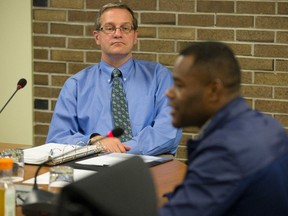 City chief administrator Art Zuidema listens to Coun. Mo Salih during a city meeting Wednesday, a day after their verbal dust-up. (DEREK RUTTAN, The London Free Press)