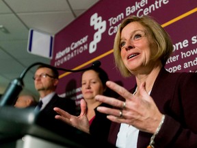 Premier Rachel Notley speaks with media at the Tom Baker Cancer Centre in Calgary, Alta., on Wednesday, Oct. 28, 2015. She was announcing further plans for a new cancer centre that will eventually replace the Tom Baker. Lyle Aspinall/Postmedia Network