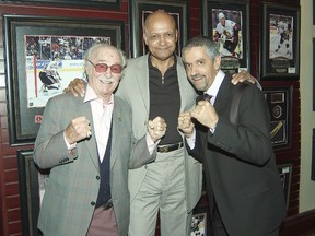 Boxing promoter Irving Ungerman, left, George's manager, with event emcees Spider Jones, a three-time Golden Glove champ, now a radio host for CFRB, and boxing trainer Russ Anber, host of TSN's In This Corner.