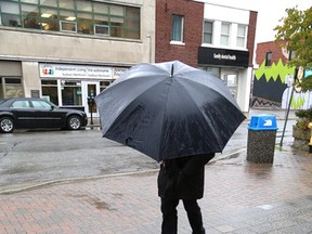 There were lots of umbrellas used by Greater Sudburians on Wednesday October 28, 2015 as the rain fell all day. Conservation Sudbury issued a flood outlook warning because of the potential of 40 mm of rain dropping on the city because of a fall storm attributed to Hurricane Patricia. John Lappa/Sudbury Star/Postmedia Network