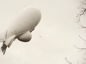 An unmanned Army surveillance blimp floats through the air while dragging a tether line just south of Millville, Pa., on Oct. 28, 2015. The bulbous, 240-foot helium-filled blimp came down near Muncy, a small town about 80 miles north of Harrisburg. (Jimmy May/Bloomsburg Press Enterprise via AP)