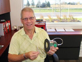 Paul Groeneveld, Norwich Township fire chief, shows one of the oxygen masks for pets that the fire service received from a company called Invisible Fence. These masks are used to treat animals suffering from smoke inhalation. (MEGAN STACEY, Sentinel-Review)