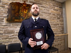 EMILY MOUNTNEY-LESSARD/THE INTELLIGENCER
Paramedic Dominic Rehayem is shown here in with the N.H. McNally Award for Bravery he received at the Ontario Association of Paramedic Chiefs Conference and Awards in September. He is shown here at the Hastings County building on Thursday.