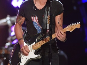In this April 18, 2015 file photo, Keith Urban performs at "ACM Presents: Superstar Duets" in Arlington, Texas. (Chris Pizzello/Invision/AP, File)