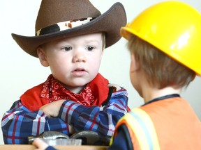 Cowboy Keaton Brown talks shop with Bob the Builder Ethan Schoonderwoerd during the annual Halloween dress-up day at Avon Co-operative Nursery School on Thursday October 29, 2015 in Stratford, Ont. Sarnia Police and Lambton OPP have issued a series of Halloween tips for Saturday's activities. (Scott Wishart/Stratford Beacon Herald/Postmedia Network)