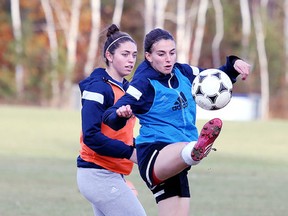 Laurentian Voyageurs women's soccer team members run through a drill during team practice in Sudbury, Ont. on Tuesday October 27, 2015.