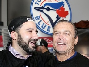Outgoing Jays GM Alex Anthopoulos and manager John Gibbons celebrate after winning the ALDS in five games. With Anthopoulos not returning and a new boss coming in, the writing might be on the wall for Gibbons’ exit as well. (Postmedia Network)