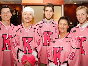 Kingston Frontenacs players, Chad Duchesne, left, Roland McKeown and Spencer Watson pose for a photo with Christine Styles, left, and Kim Campbell, two breast cancer survivors, in the limited edition pink jerseys at the Cataraqui Centre. The fourth annual Pink in the Rink game takes place Friday against the visiting Peterborough Petes at the Rogers K-Rock Centre. (Julia McKay/The Whig-Standard)
