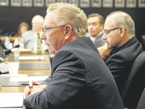 Luke Hendry/The Intelligencer
Prince Edward County Mayor Robert Quaiff speaks during a special meeting of area mayors and health officials at Hastings County headquarters in Belleville Thursday. Mayors attacked Ontario's new funding formula for hospitals. With him at the table were Mayors Jim Harrison of Quinte West, back left, Mark Walas of Brighton and Taso Christopher of Belleville.