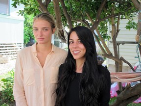 Courtney Wilson, left, and Taylor Guerrero pose for a photo in Honolulu on Wednesday, Oct. 28, 2015. The Honolulu Police Department has opened an internal investigation into allegations that an officer wrongfully arrested a vacationing lesbian couple after seeing them kissing in a grocery store. (AP Photo/Jennifer Sinco Kelleher)