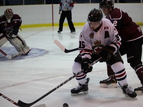 Sarnia Legionnaires forward Jordan Fogarty fights for the puck with Chatham Maroons defenceman Connor McKinnon nearby during the Greater Ontario Junior Hockey League game at Sarnia Arena Thursday night. The teams faced off for the third time this season. (Terry Bridge/Sarnia Observer/Postmedia Network)