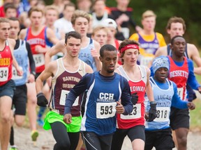 Muhumed Sirage of CCH leads down a slight hill in the senior boys WOSSAA cross-country race in Springwater CA near Aylmer, south east of London, Ont. on Thursday October 29, 2015. (MIKE HENSEN, The London Free Press)