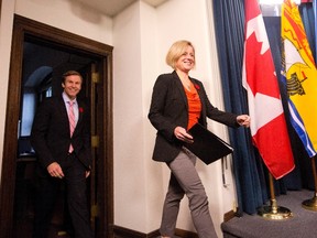Alberta Premier Rachel Notley and New Brunswick Premier Brian Gallant walk into a press conference after a meeting in Edmonton Alta, on Thursday October 29, 2015. THE CANADIAN PRESS/Jason Franson