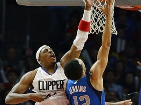 LOS ANGELES CA - OCTOBER 29: John Jenkins #12 of the Dallas Mavericks is fouled by Paul Pierce #34 of the Los Angeles Clippers during the third quarter of the basketball game at Staples Center October 29, 2015, in Los Angeles California. NOTE TO USER: User expressly acknowledges and agrees that, by downloading and or using this photograph, User is consenting to the terms and conditions of the Getty Images License Agreement.   Kevork Djansezian/Getty Images/AFP== FOR NEWSPAPERS, INTERNET, TELCOS & TELEVISION USE ONLY ==