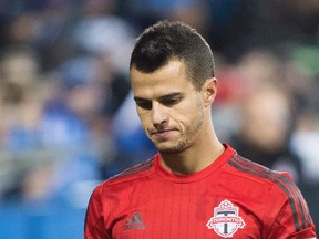 Toronto FC's Sebastian Giovinco walks off the pitch after losing an MLS soccer game to the Montreal Impact in Montreal, Sunday, October 25, 2015. THE CANADIAN PRESS/Graham Hughes