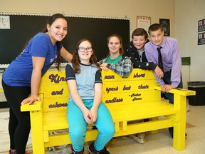 Lansdowne Public School students Kaylynn Payette, left, Rain Morin, Leena Marcotte, Thomas Rideout and Troy Jones show off the school's buddy bench at the school in Sudbury, Ont. on Thursday October 29, 2015. The school is slated for closure ion 2019. John Lappa/Sudbury Star/Postmedia Network