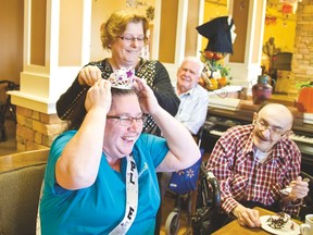 Laurie Burke is presented with a tiara, $2,000 and a party for being named Golden Life's employee of the year on Thursday, Oct. 29, 2015. Jocelyn Doll photos/Pincher Creek Echo.