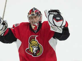 Ottawa Senators goalie Craig Anderson celebrates after winning the game in a shoot-out against the Calgary Flames Wednesday October 28, 2015 in Ottawa. THE CANADIAN PRESS/Adrian Wyld