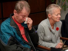 Keith White Sr and his wife Sherry, of London, are overcome with emotion during a press conference to announce that they have launched a lawsuit against those they say are responsible for the drowning death of their son Keith White on June 13, 2015. The press conference was held on Friday October 30, 2015 at the office of their lawyer Phillip Millar, in Killworth, Ontario. (MORRIS LAMONT / THE LONDON FREE PRESS / POSTMEDIA NETWORK)