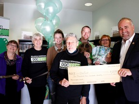 Emily Mountney-Lessard/The Intelligencer
MPP Todd Smith presents an arts grant to Gary Magwood, DocFest co-chairman, at the Belleville Public Library, Friday in Belleville. Shown in back are DocFest supporters Lynn Brawn, Karen Scott, Laura Voskamp, Dug Stevenson, Holly Dewar.