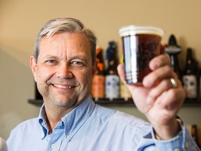 Neil Herbst, co-owner of Alley Kat Brewing Company.  The Alberta government has changed the way breweries are taxed.Photo by   Ian Kucerak/Postmedia Network
