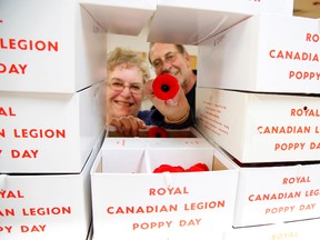 Royal Canadian Legion Branch 52 president Joel Chandler and executive member Sheila Davidson sort through boxes loaded with poppies at the legion building on Lansdowne St. W. on Friday October 30, 2015 in Peterborough, Ont. in preparation for the annual Poppy Campaign. Look for more members and veterans canvassing poppies up to Remembrance Day on November 11. Clifford Skarstedt/Peterborough Examiner/Postmedia Network