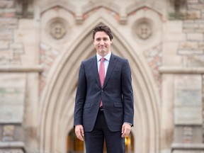 Prime minister designate Justin Trudeau walks to a news conference from Parliament Hill in Ottawa on Oct. 20, 2015. The Governor General's office has made it official: David Johnston will preside over the swearing in of the new Trudeau government next Wednesday morning. The ceremony will see Justin Trudeau become Canada's 23rd prime minister, replacing Stephen Harper after the Liberals defeated the Conservatives in the Oct. 19 election. THE CANADIAN PRESS/Adrian Wyld